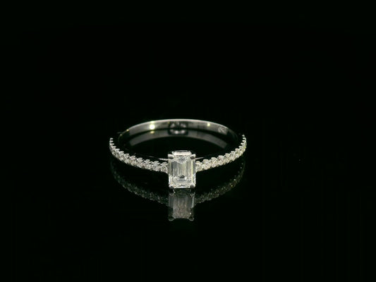 Emerald-cut diamond ring in 18K white gold with pavé band – 0.40ct D/VS1 GIA center stone by Emirates Diamonds.