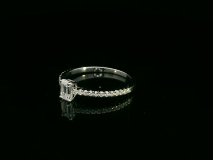 Emerald-cut diamond ring in 18K white gold with pavé band – 0.40ct D/VS1 GIA center stone by Emirates Diamonds.