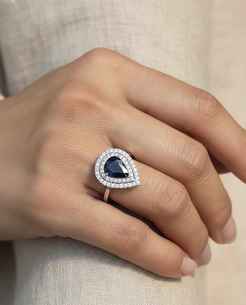 18K white gold pear-shaped blue sapphire ring – 2.31ct sapphire with 0.51ct double diamond halo by Emirates Diamonds