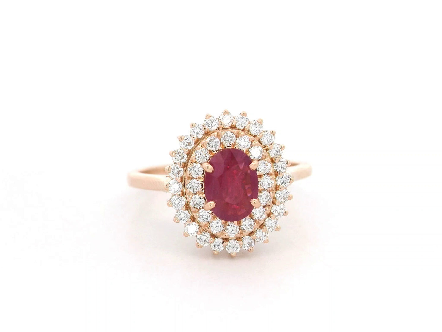 18K rose gold ruby and diamond double-halo ring – 0.80ct oval ruby with 0.45ct diamonds by Emirates Diamonds.
