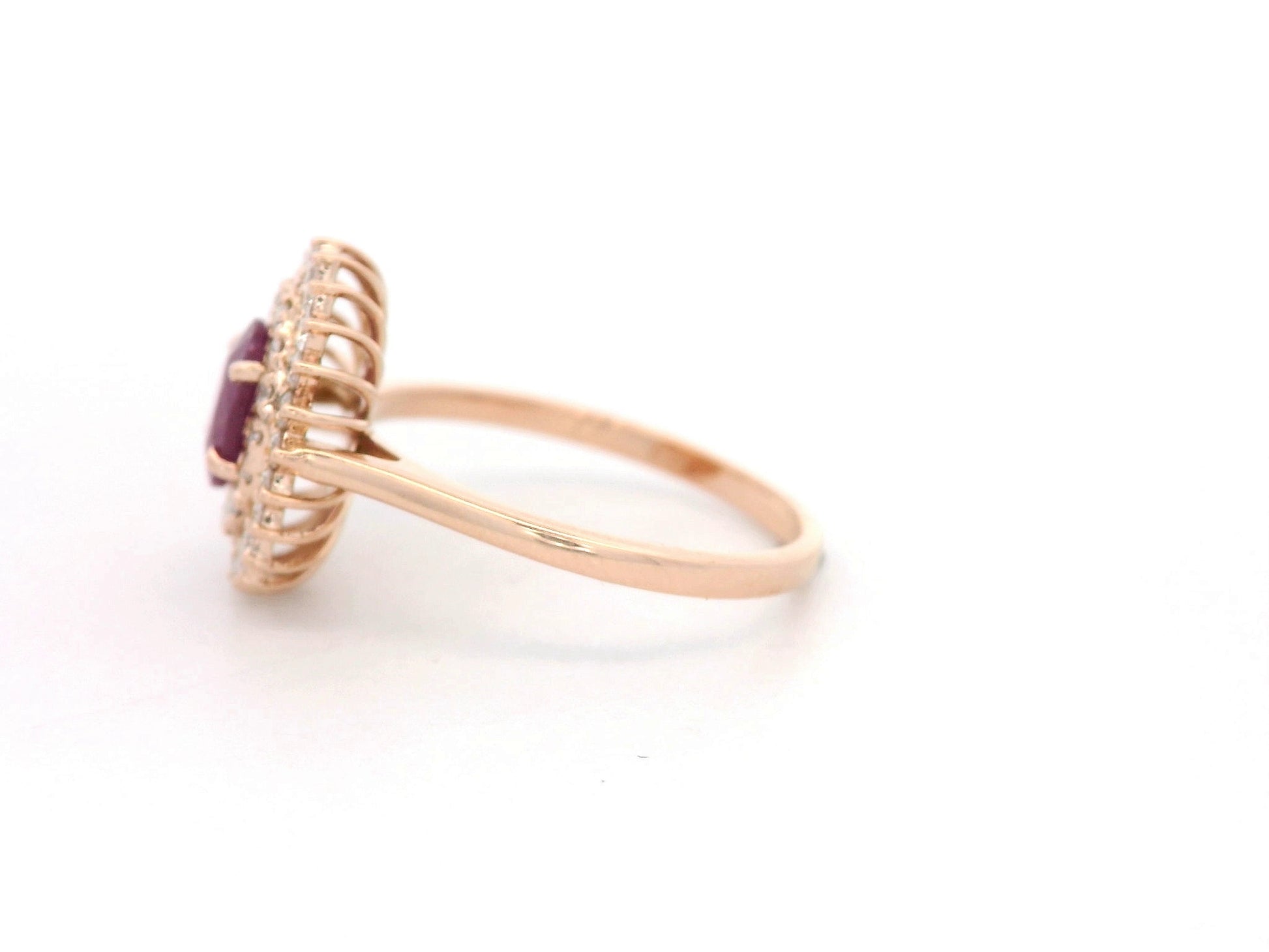 18K rose gold ruby and diamond double-halo ring – 0.80ct oval ruby with 0.45ct diamonds by Emirates Diamonds.