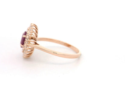 18K rose gold ruby and diamond double-halo ring – 0.80ct oval ruby with 0.45ct diamonds by Emirates Diamonds.