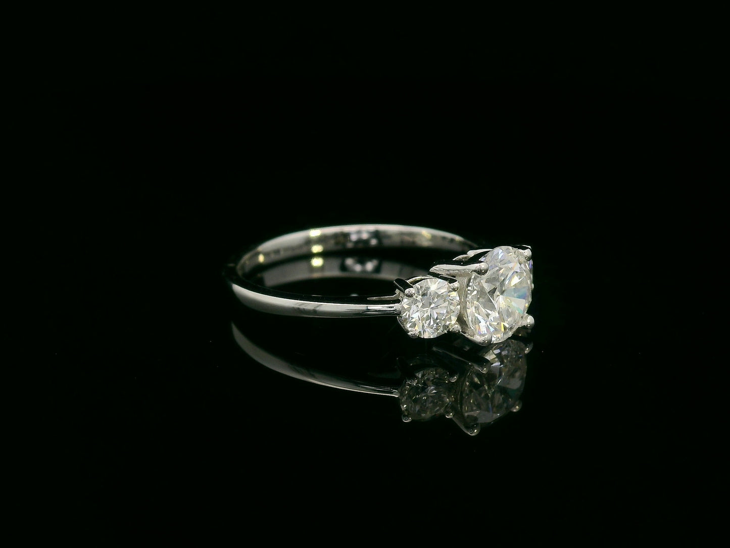 18K white gold three-stone diamond ring with 1.01ct SI2 F-color center and 0.47ct side diamonds – Emirates Diamonds.