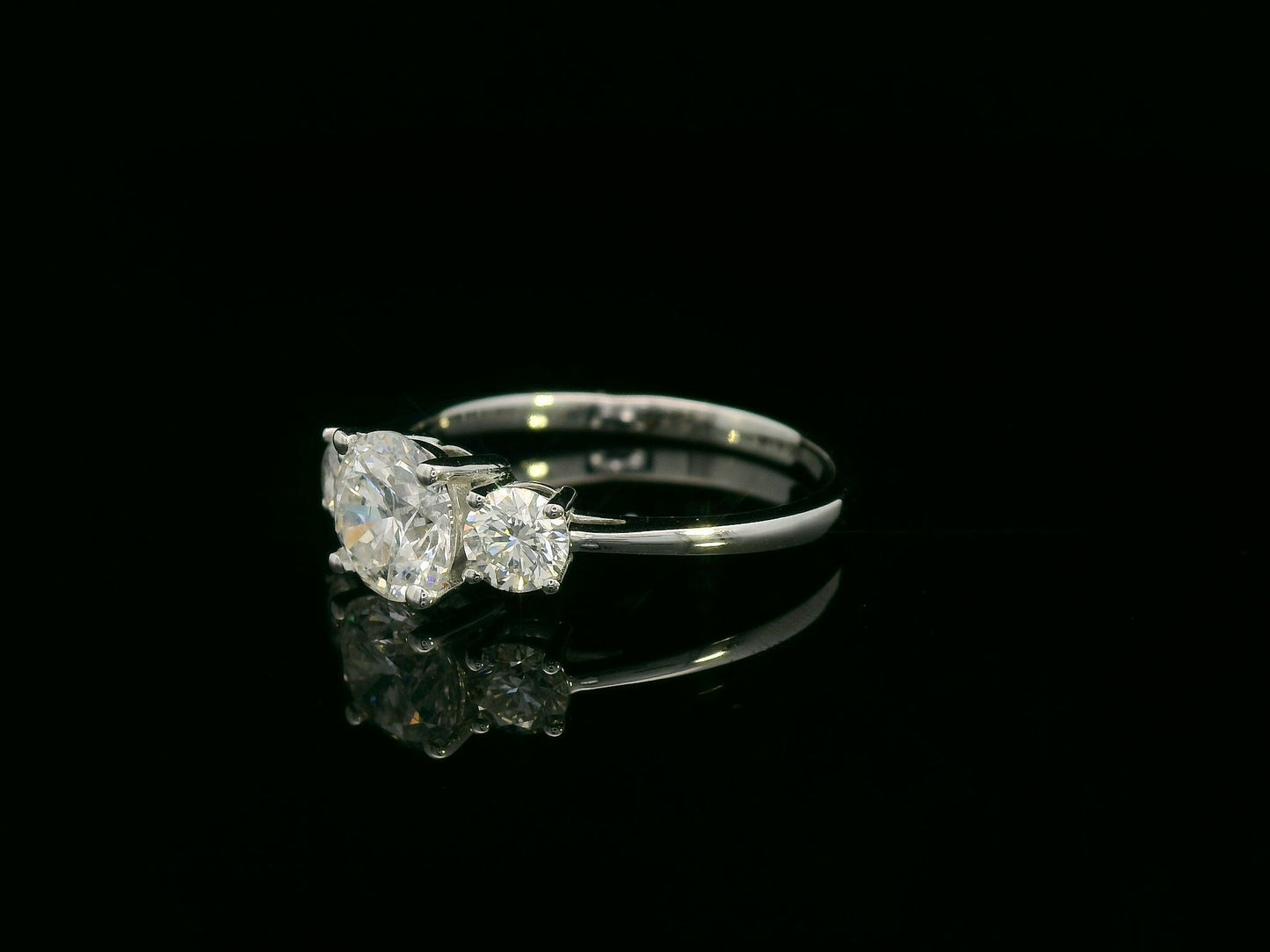 18K white gold three-stone diamond ring with 1.01ct SI2 F-color center and 0.47ct side diamonds – Emirates Diamonds.