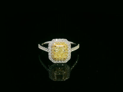 18K white gold fancy yellow radiant-cut diamond ring with yellow inner halo and white diamond outer halo by Emirates Diamonds.