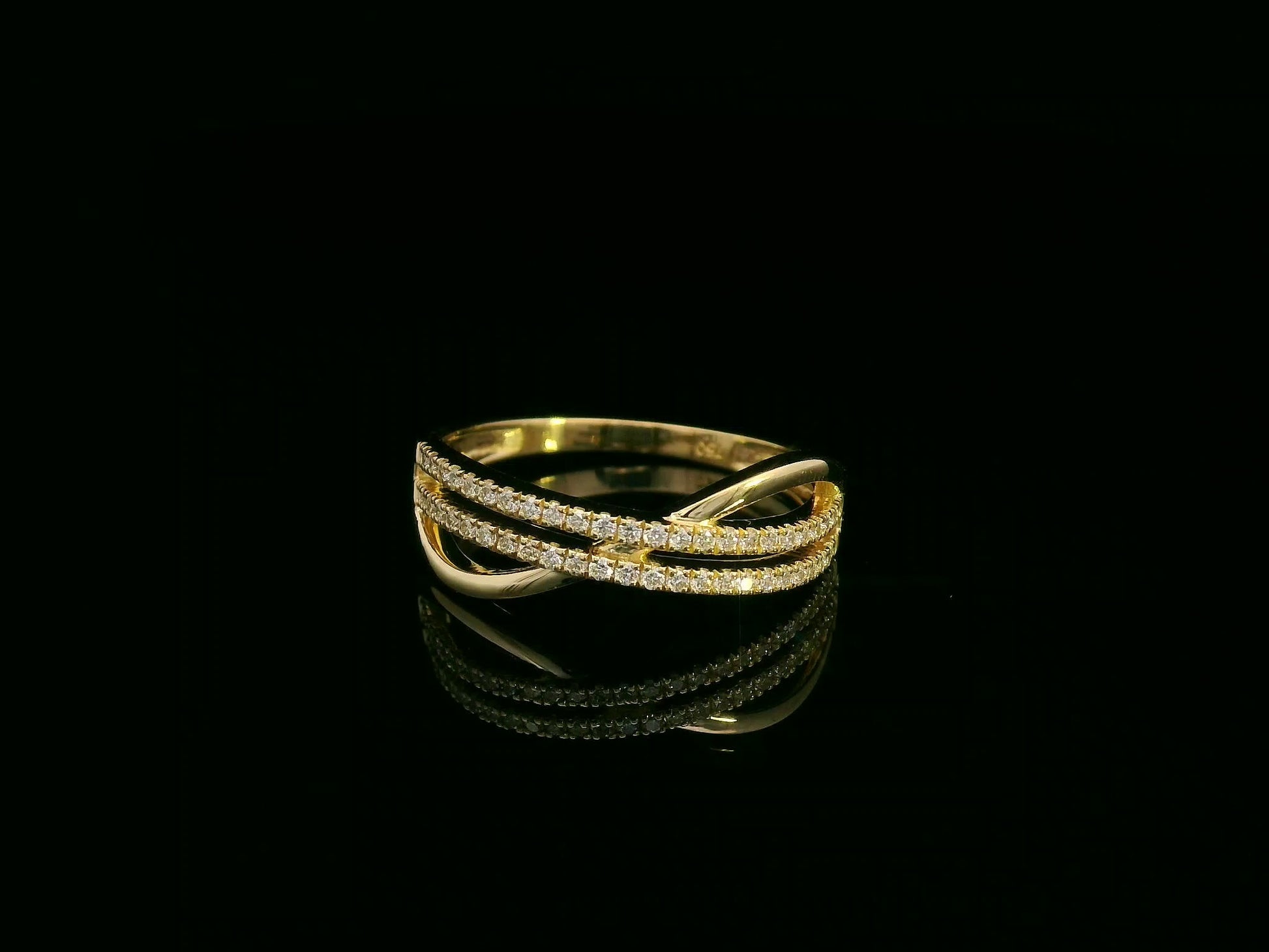 18K yellow gold overlapping diamond band with three pavé-set rows – Emirates Diamonds fine jewelry.