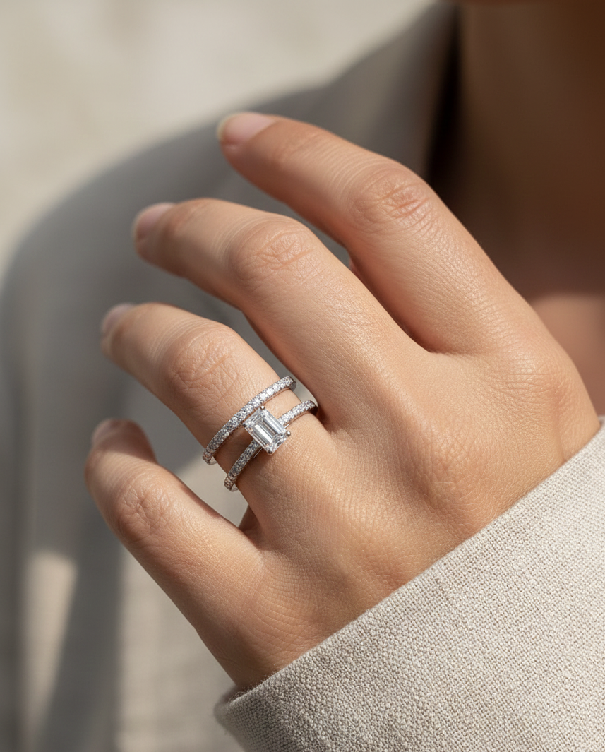 18K white gold emerald-cut diamond bridal ring set with pavé diamond band – 0.90ct center stone, luxury fine jewelry by Emirates Diamonds.