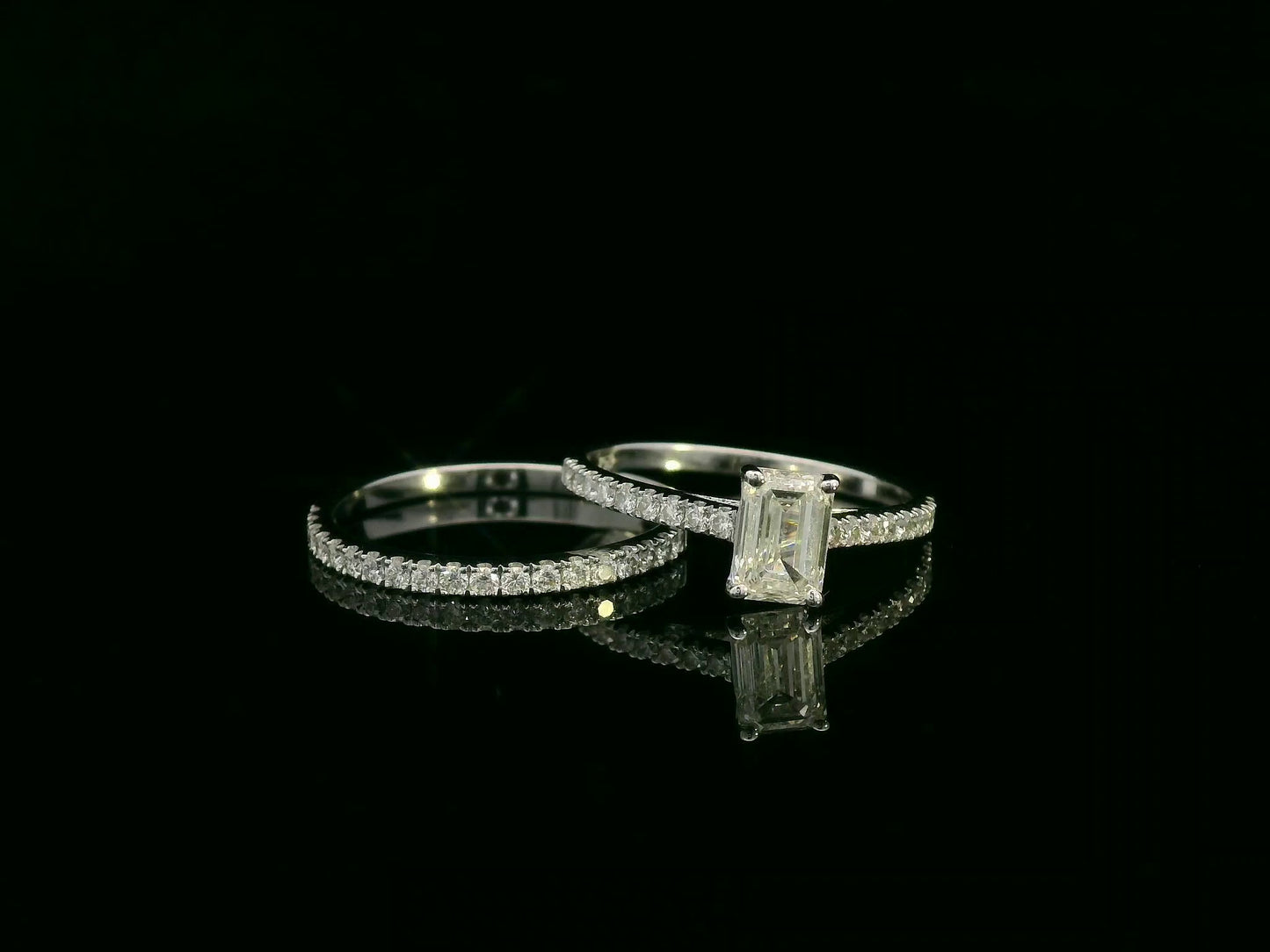 18K white gold emerald-cut diamond bridal ring set with pavé diamond band – 0.90ct center stone, luxury fine jewelry by Emirates Diamonds.