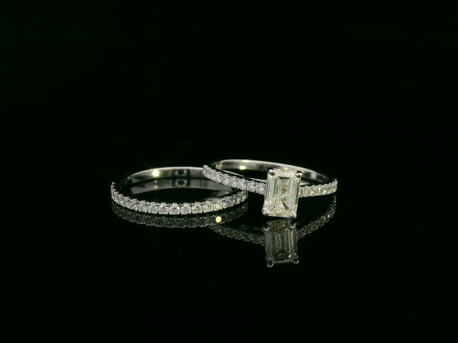 18K white gold emerald-cut diamond bridal ring set with pavé diamond band – 0.90ct center stone, luxury fine jewelry by Emirates Diamonds.