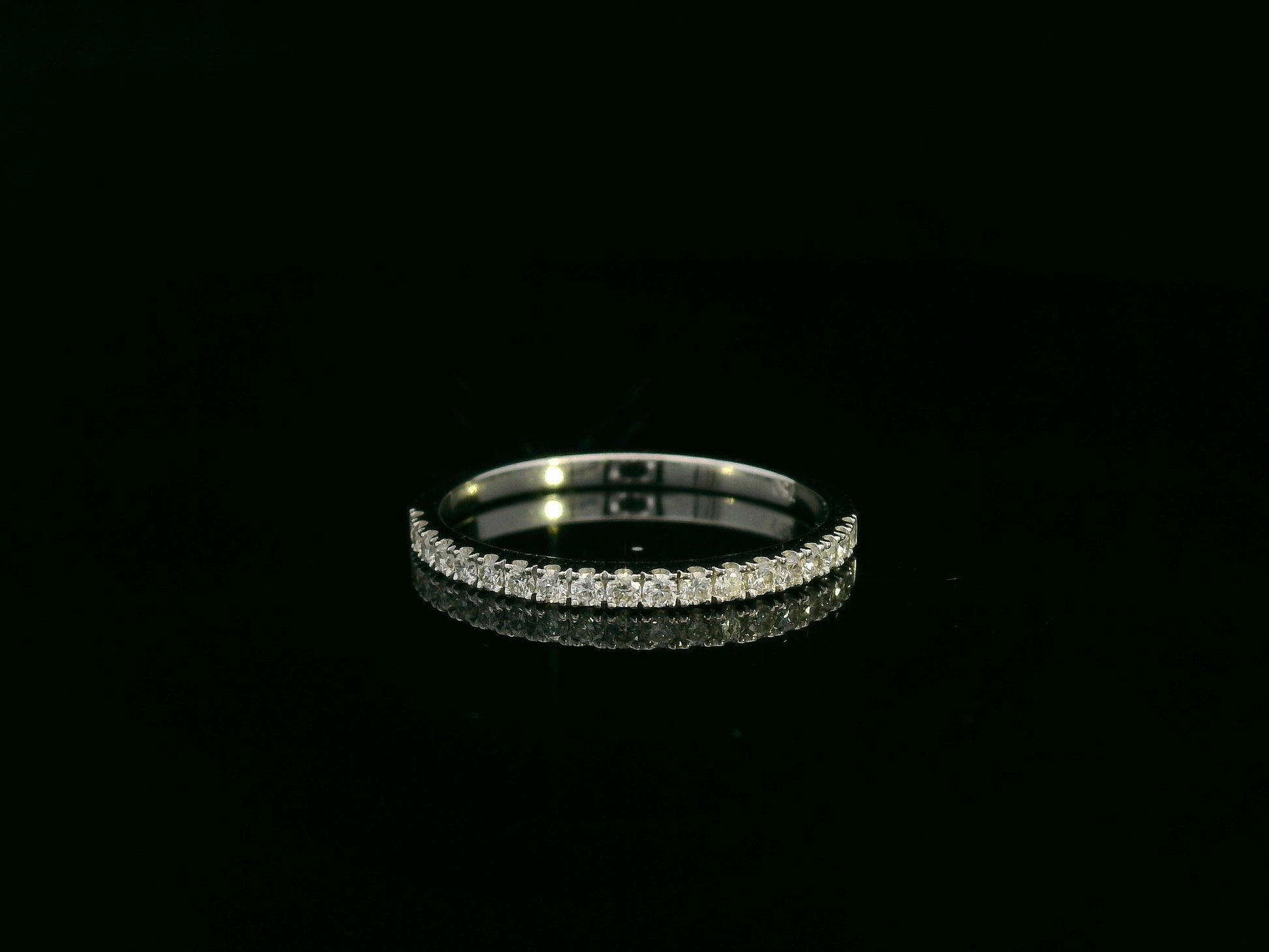 18K white gold emerald-cut diamond bridal ring set with pavé diamond band – 0.90ct center stone, luxury fine jewelry by Emirates Diamonds.