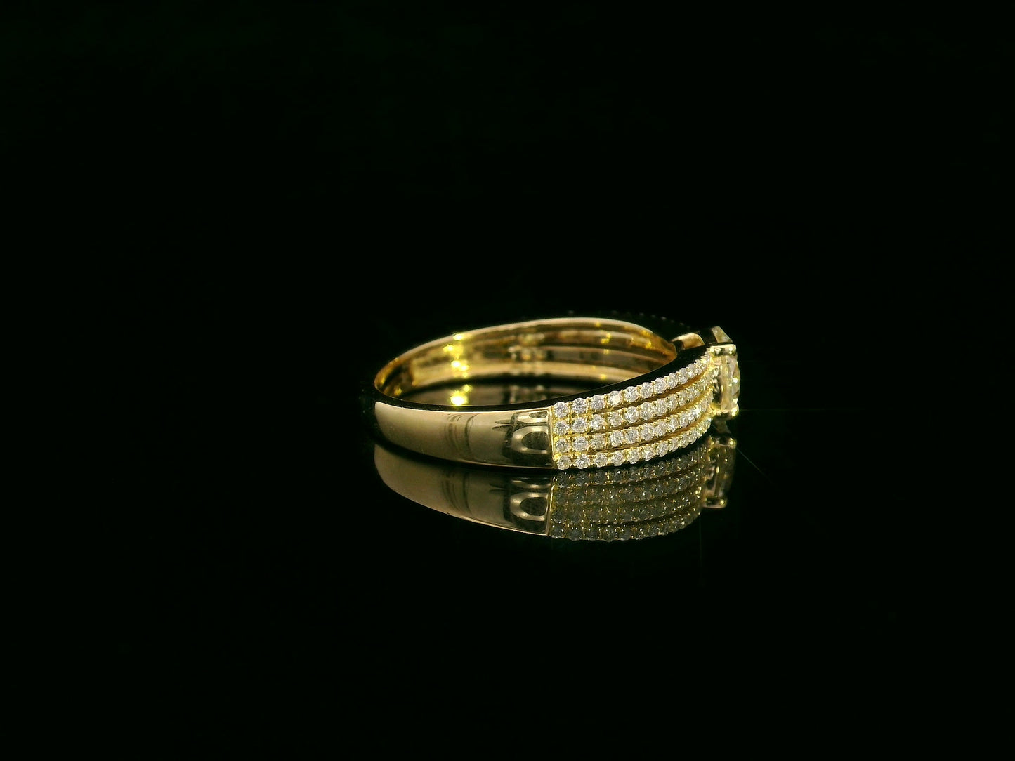 18K yellow gold diamond engagement ring with 0.64 carat center diamond and pavé-set accent diamonds by Emirates Diamonds