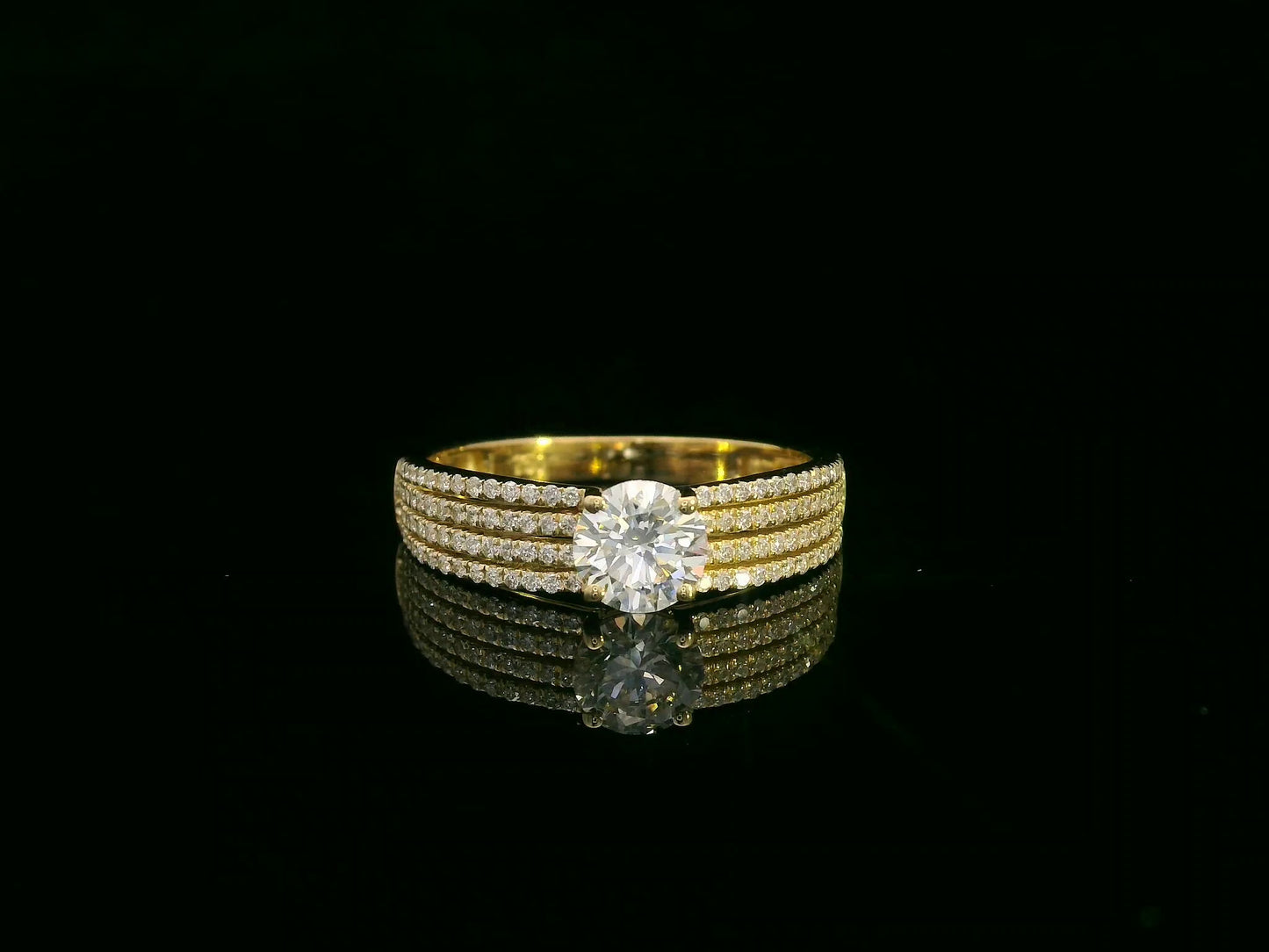 18K yellow gold diamond engagement ring with 0.64 carat center diamond and pavé-set accent diamonds by Emirates Diamonds