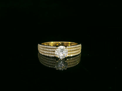 18K yellow gold diamond engagement ring with 0.64 carat center diamond and pavé-set accent diamonds by Emirates Diamonds