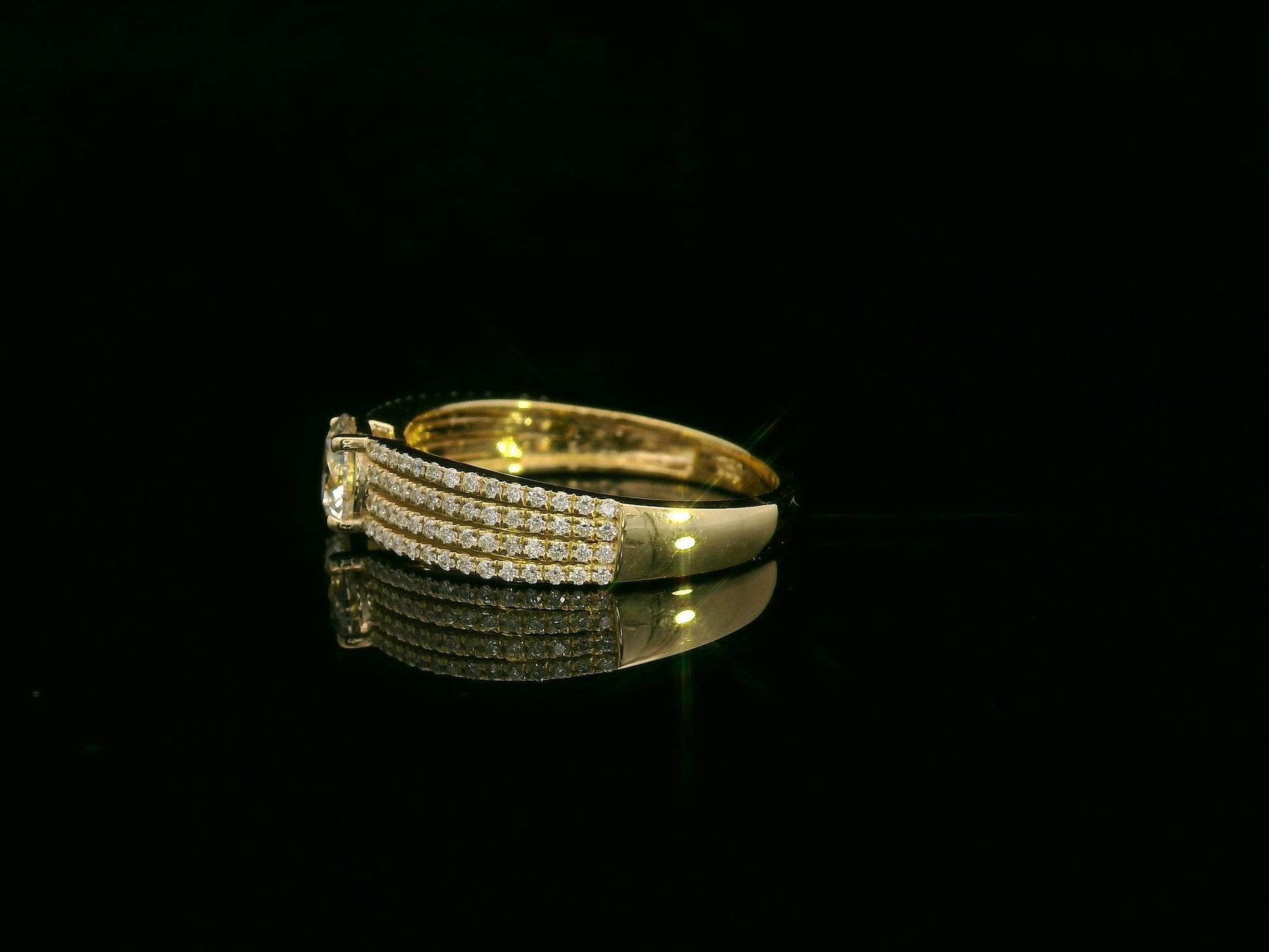 18K yellow gold diamond engagement ring with 0.64 carat center diamond and pavé-set accent diamonds by Emirates Diamonds