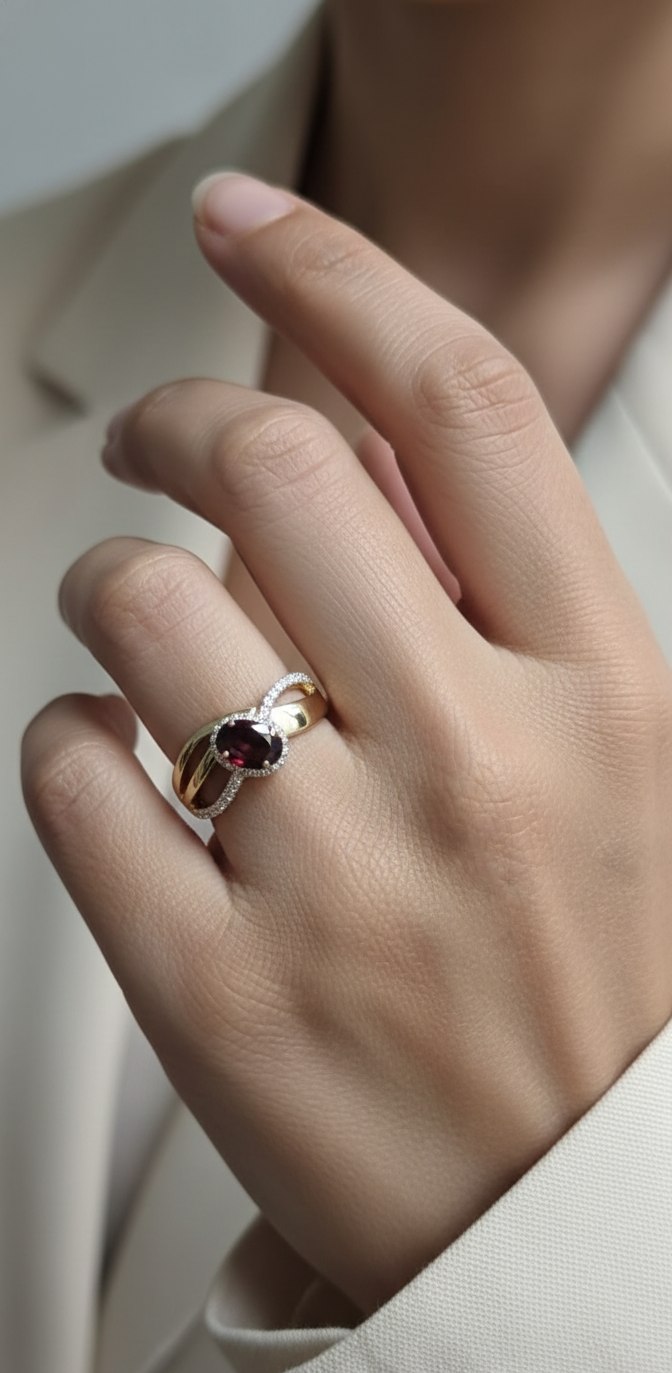 18K yellow gold garnet ring with 1.25ct oval garnet and 0.21ct diamond split-shank design – Emirates Diamonds