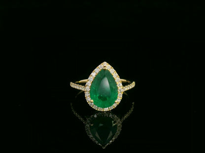 18K yellow gold pear-shaped emerald and diamond halo ring with 2.69 carat emerald and 0.40 carat total diamond weight by Emirates Diamonds