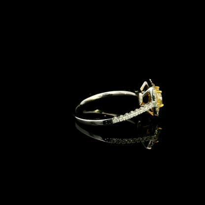 18K white gold engagement ring featuring a 0.58 carat GIA certified Fancy Yellow cushion cut diamond with SI1 clarity, surrounded by yellow and white diamond double halos with a diamond-set band.