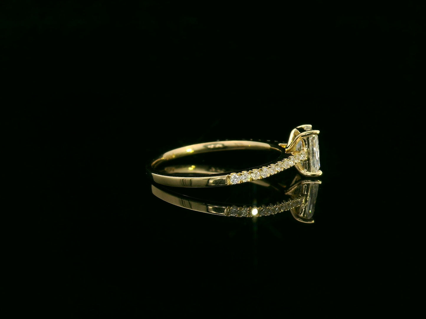 18K yellow gold radiant-cut diamond solitaire ring with pavé diamond band, 0.90 carat IGI certified center diamond and 0.21 carat accent diamonds by Emirates Diamonds