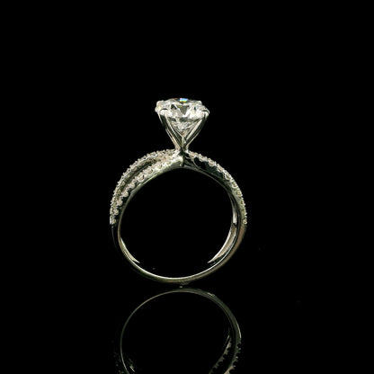 18K white gold engagement ring featuring a 2.01 carat GIA certified round brilliant diamond with D color and SI2 clarity in a four-prong setting with a diamond split shank band.