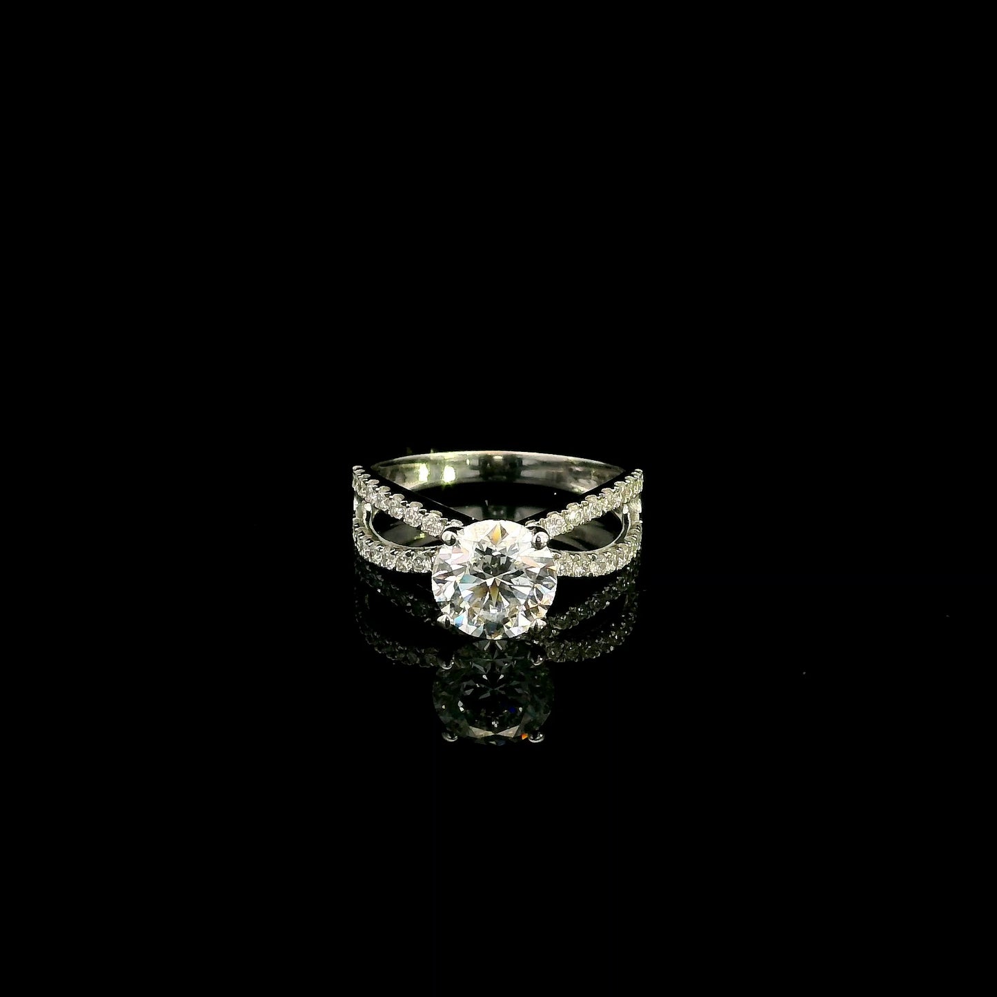 18K white gold engagement ring featuring a 2.01 carat GIA certified round brilliant diamond with D color and SI2 clarity in a four-prong setting with a diamond split shank band.