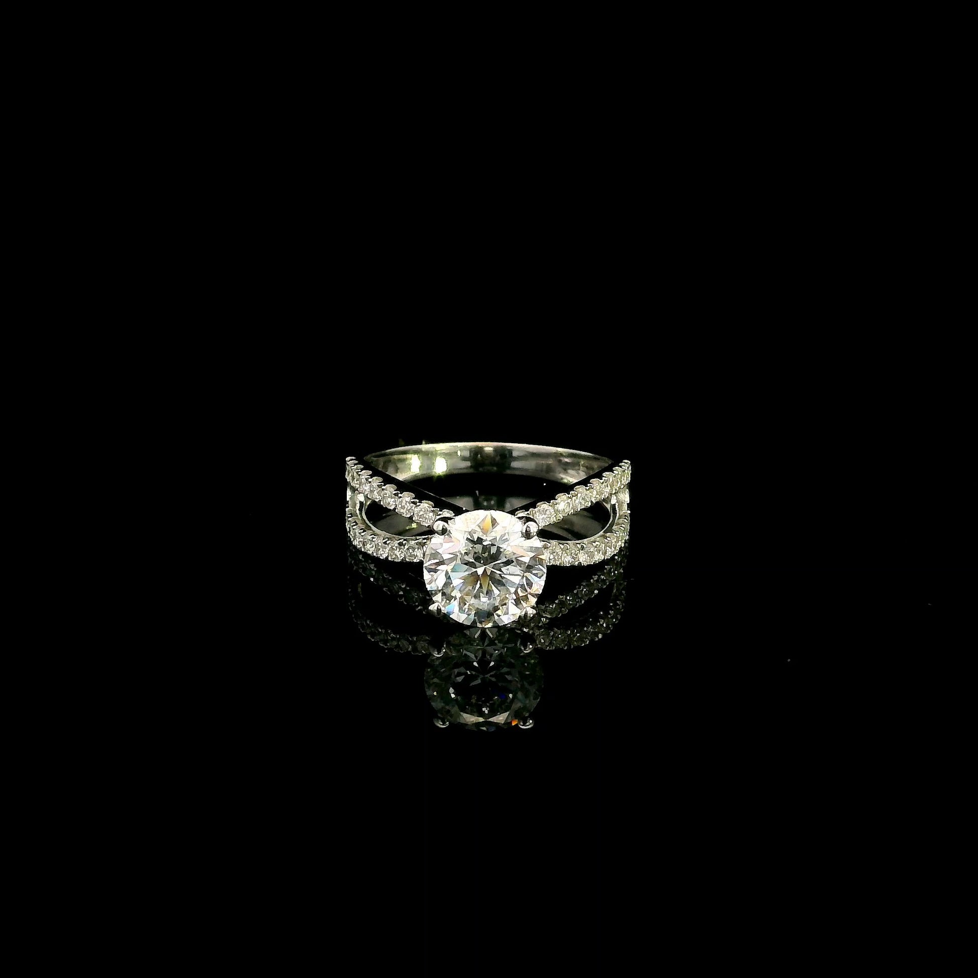 18K white gold engagement ring featuring a 2.01 carat GIA certified round brilliant diamond with D color and SI2 clarity in a four-prong setting with a diamond split shank band.