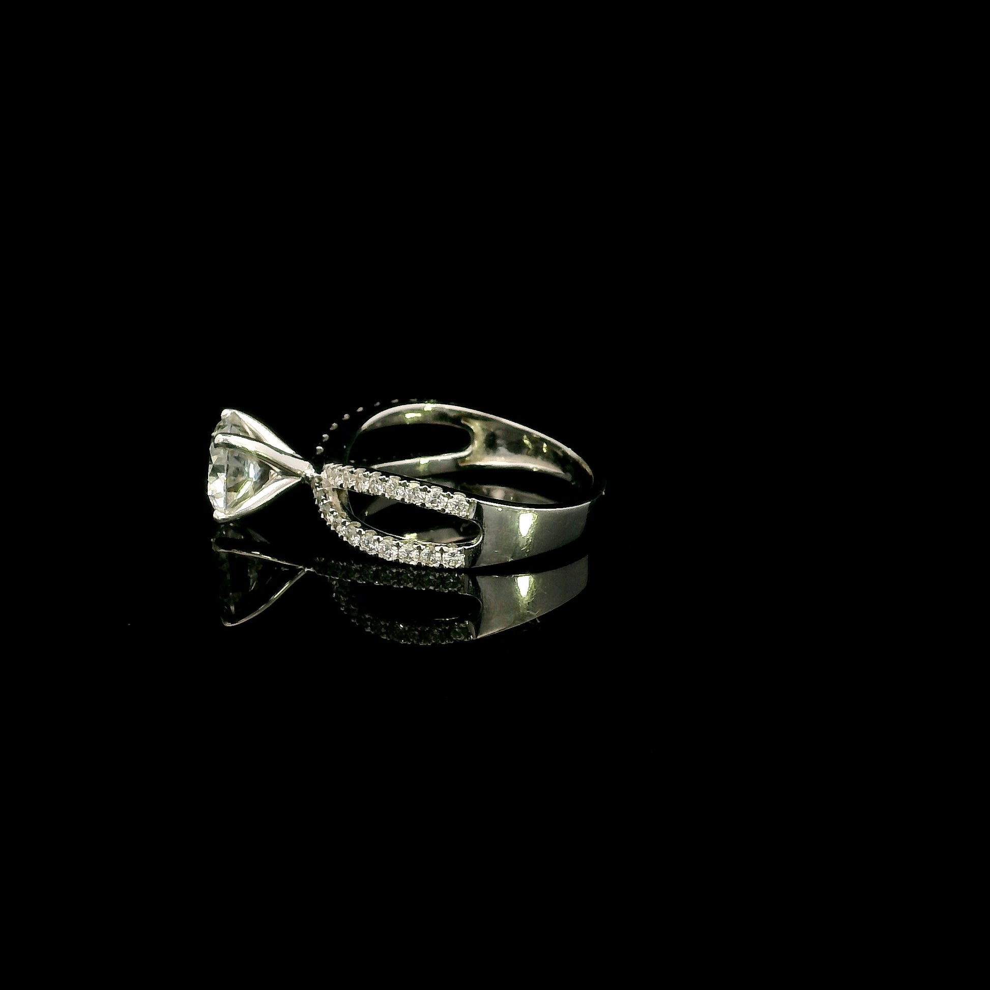 18K white gold engagement ring featuring a 2.01 carat GIA certified round brilliant diamond with D color and SI2 clarity in a four-prong setting with a diamond split shank band.