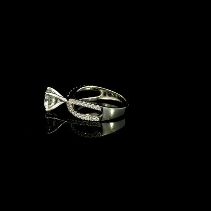 18K white gold engagement ring featuring a 2.01 carat GIA certified round brilliant diamond with D color and SI2 clarity in a four-prong setting with a diamond split shank band.