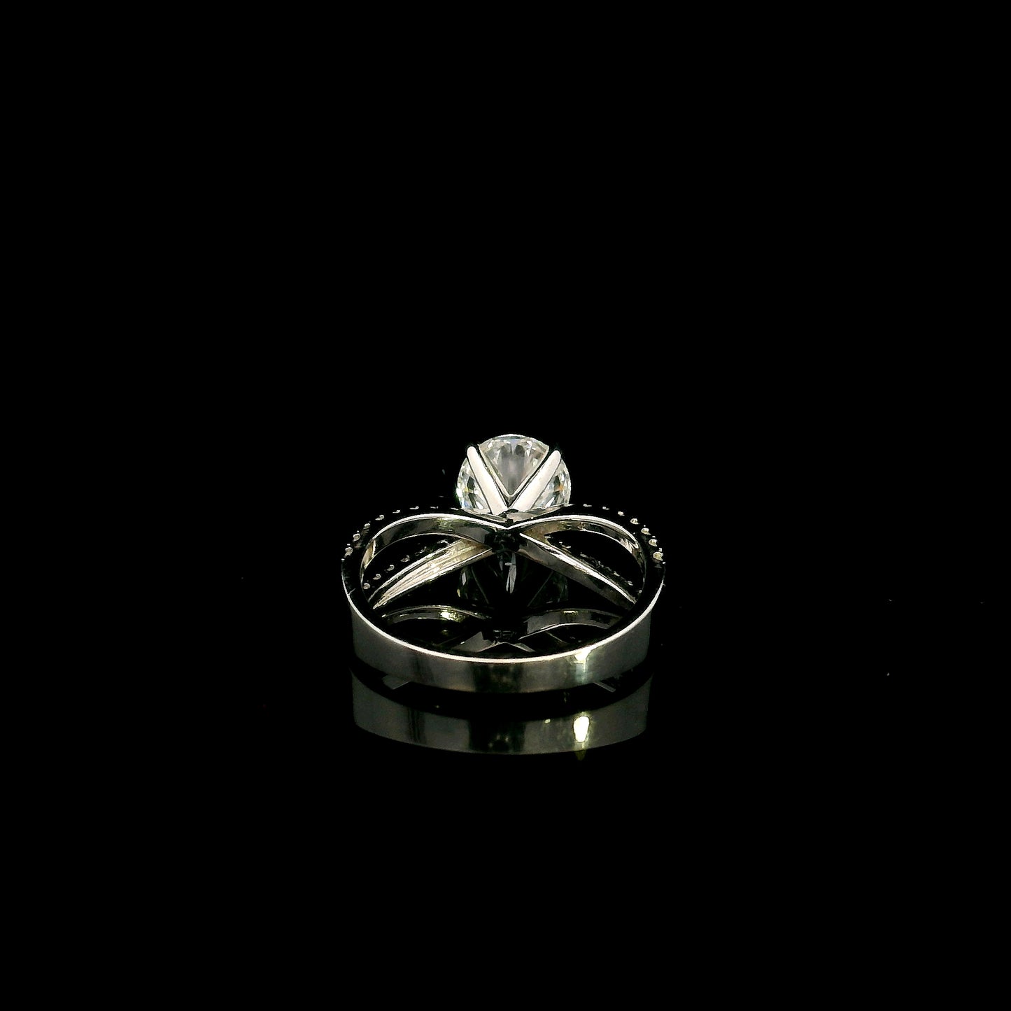 18K white gold engagement ring featuring a 2.01 carat GIA certified round brilliant diamond with D color and SI2 clarity in a four-prong setting with a diamond split shank band.