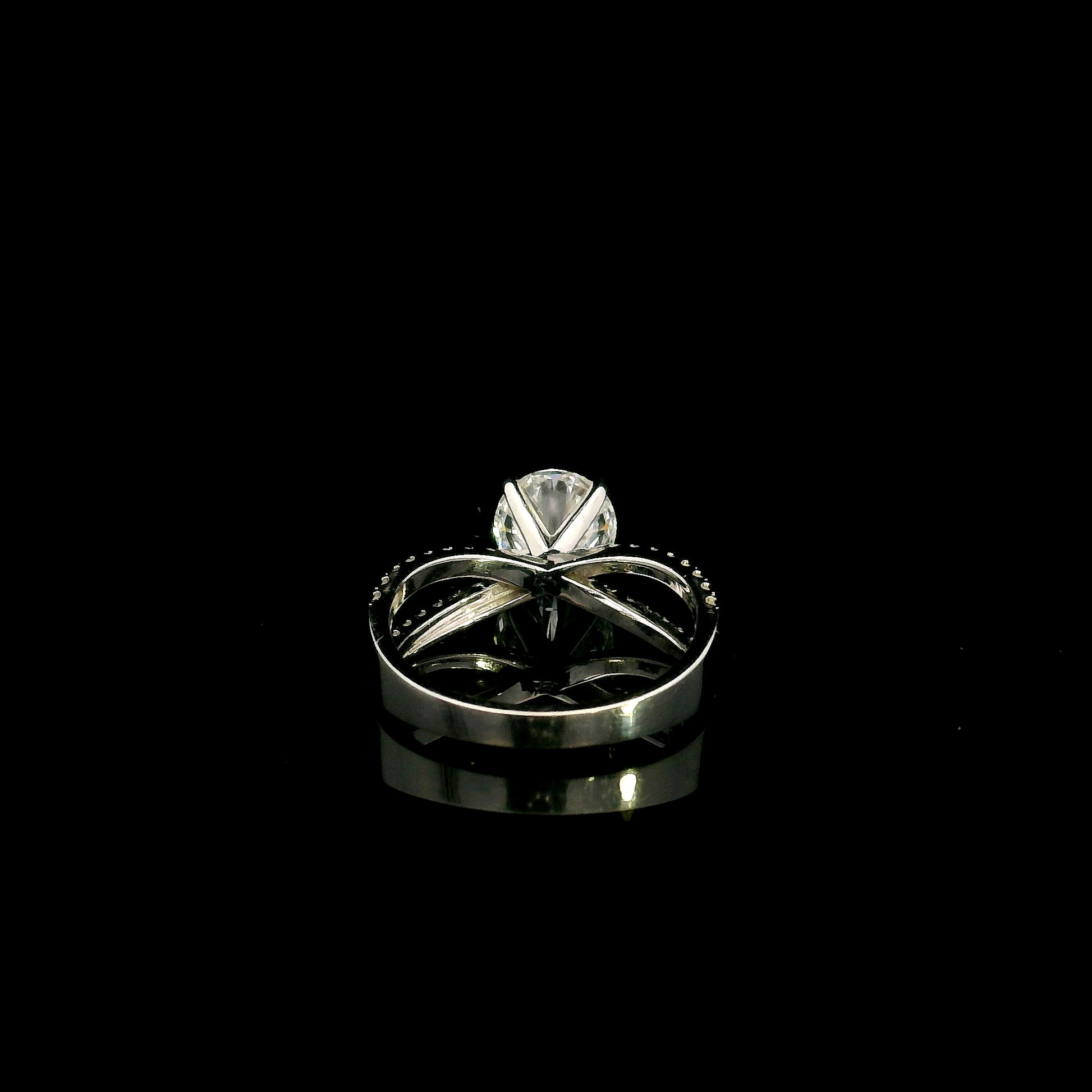 18K white gold engagement ring featuring a 2.01 carat GIA certified round brilliant diamond with D color and SI2 clarity in a four-prong setting with a diamond split shank band.