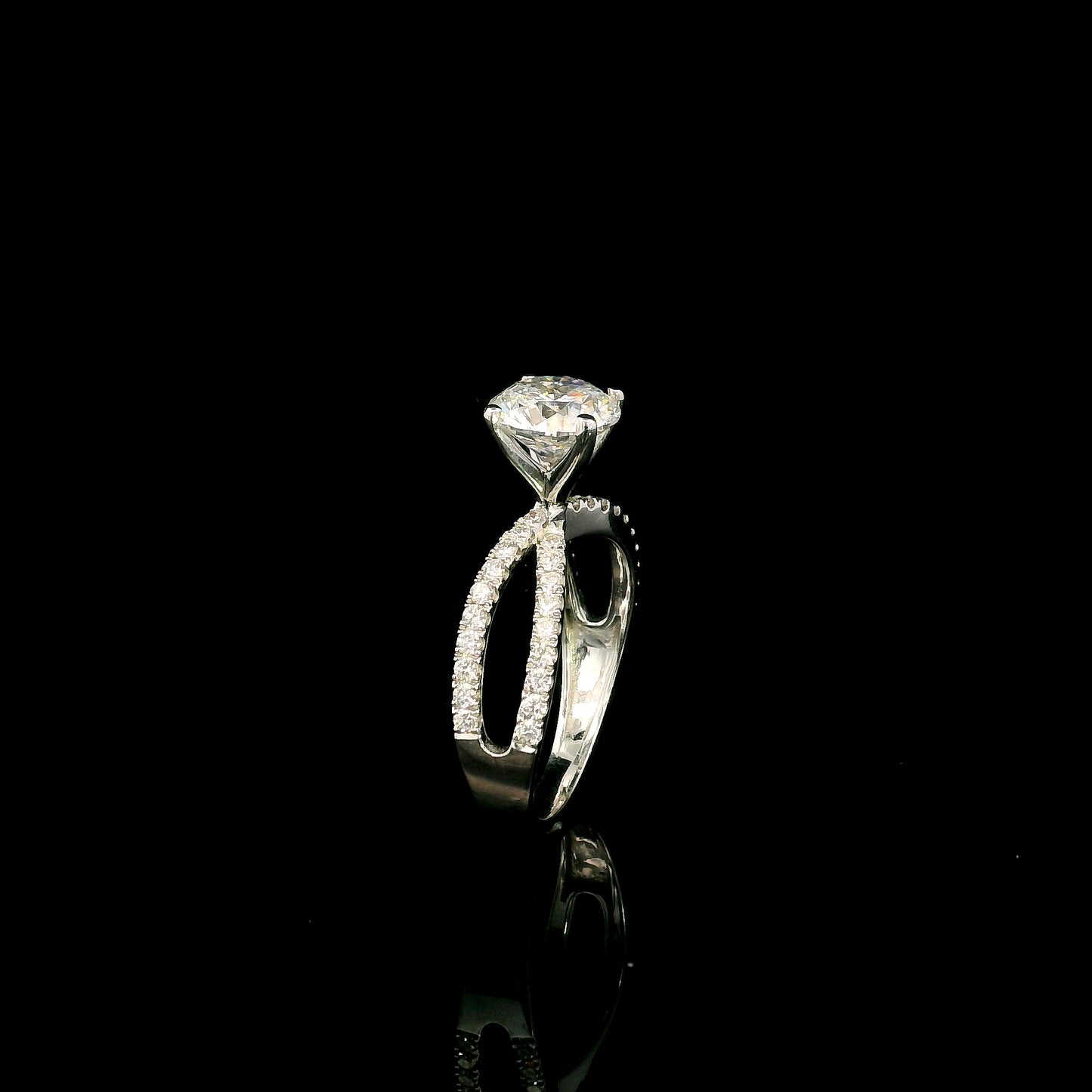 18K white gold engagement ring featuring a 2.01 carat GIA certified round brilliant diamond with D color and SI2 clarity in a four-prong setting with a diamond split shank band.