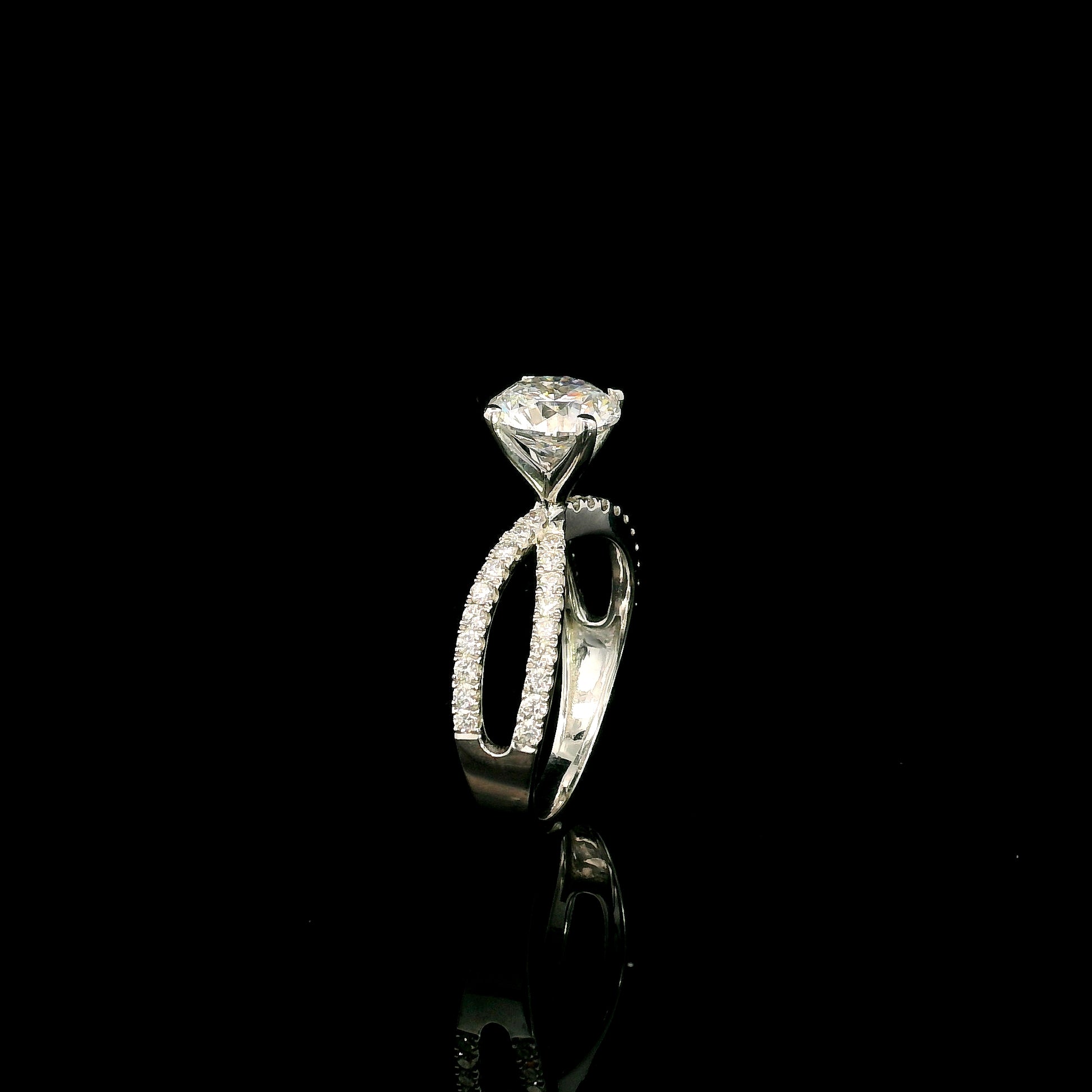 18K white gold engagement ring featuring a 2.01 carat GIA certified round brilliant diamond with D color and SI2 clarity in a four-prong setting with a diamond split shank band.