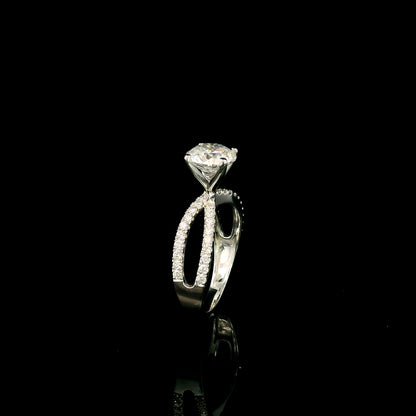 18K white gold engagement ring featuring a 2.01 carat GIA certified round brilliant diamond with D color and SI2 clarity in a four-prong setting with a diamond split shank band.