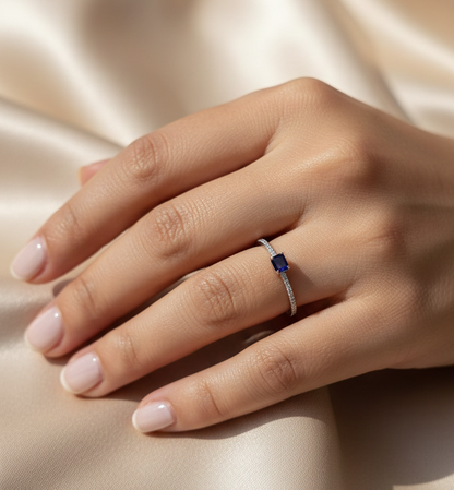 18K white gold blue sapphire solitaire ring with pavé diamond band, 0.25 carat sapphire and 0.08 carat total diamond weight by Emirates Diamonds