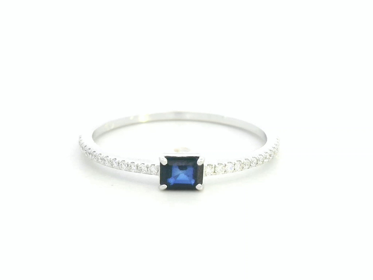 18K white gold blue sapphire solitaire ring with pavé diamond band, 0.25 carat sapphire and 0.08 carat total diamond weight by Emirates Diamonds