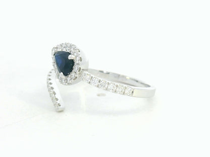 18K white gold bypass ring with pear-shaped blue sapphire and diamond halo by Emirates Diamonds