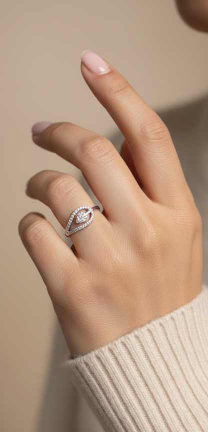 18K white gold diamond bypass ring featuring a teardrop-shaped diamond cluster and pavé set band by Emirates Diamonds