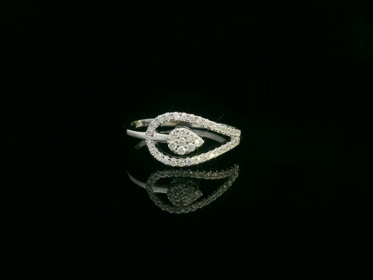 18K white gold diamond bypass ring featuring a teardrop-shaped diamond cluster and pavé set band by Emirates Diamonds