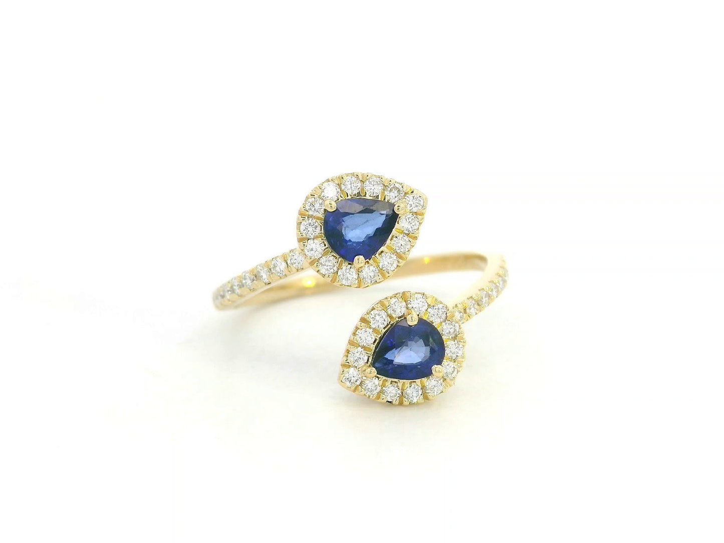 Blue sapphire and diamond Toi-et-Moi ring in 18K yellow gold with pear-shaped sapphires and diamond halo by Emirates Diamonds