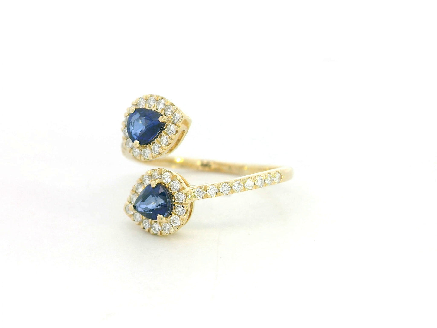Blue sapphire and diamond Toi-et-Moi ring in 18K yellow gold with pear-shaped sapphires and diamond halo by Emirates Diamonds
