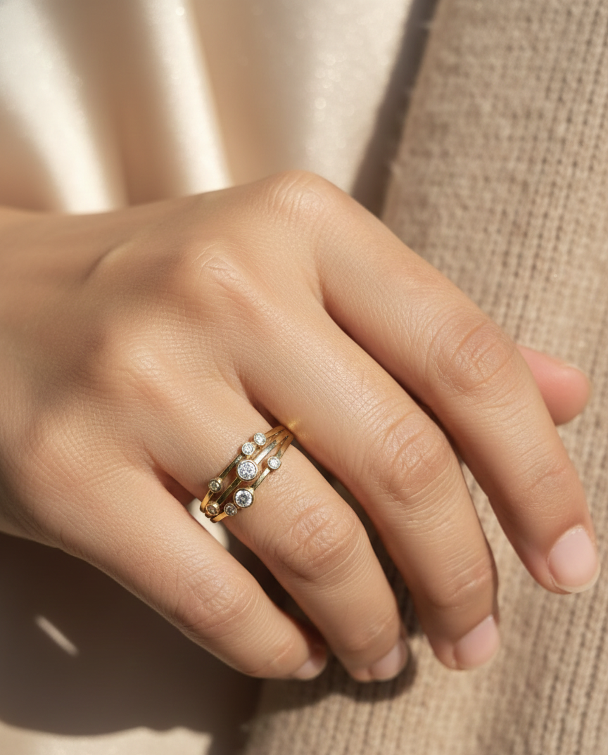 18K yellow gold multi-row diamond ring with bezel-set round diamonds, 0.23 carat diamonds, modern fine jewelry by Emirates Diamonds