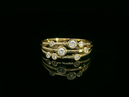 18K yellow gold multi-row diamond ring with bezel-set round diamonds, 0.23 carat diamonds, modern fine jewelry by Emirates Diamonds