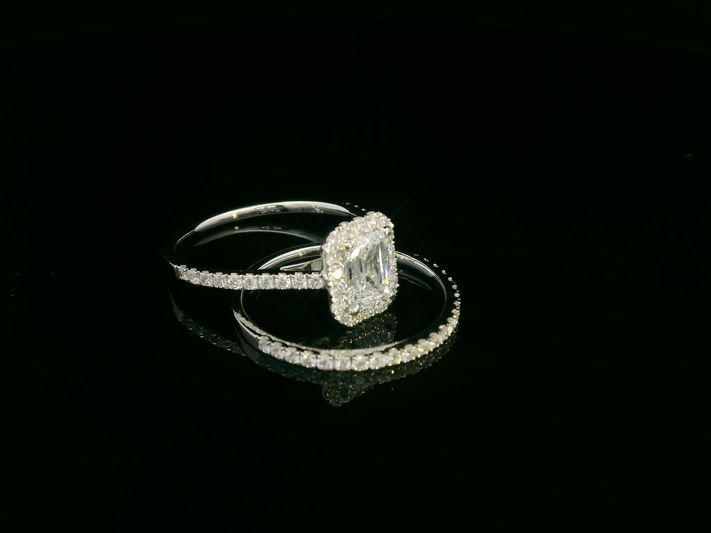 18K white gold emerald cut diamond bridal ring set with GIA certified 1.00 carat center diamond by Emirates Diamonds