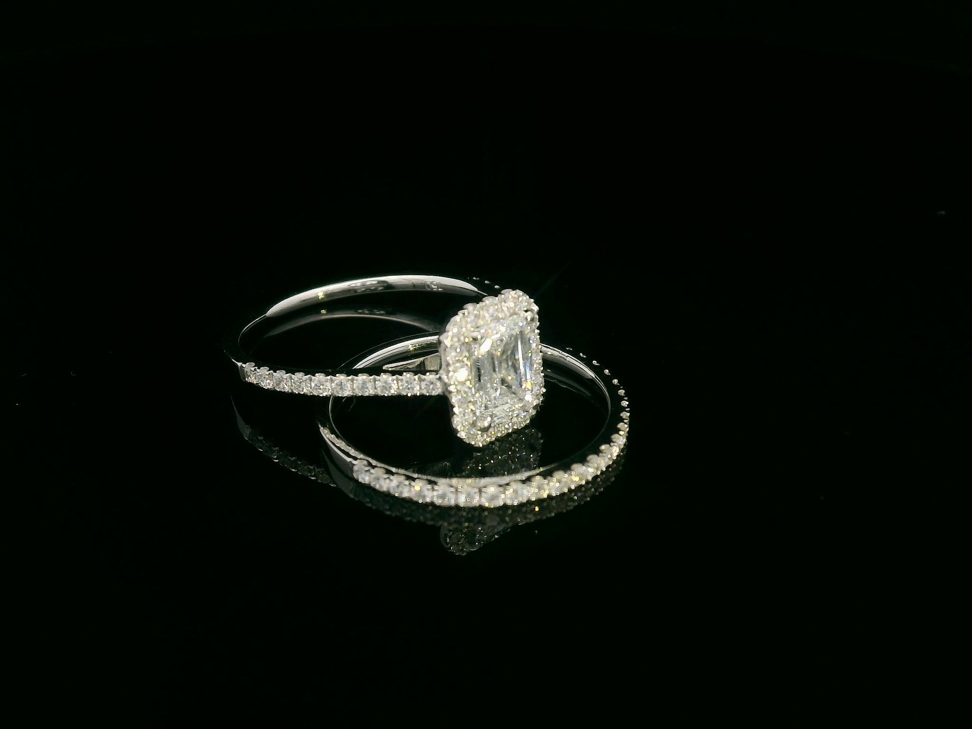 18K white gold emerald cut diamond bridal ring set with GIA certified 1.00 carat center diamond by Emirates Diamonds