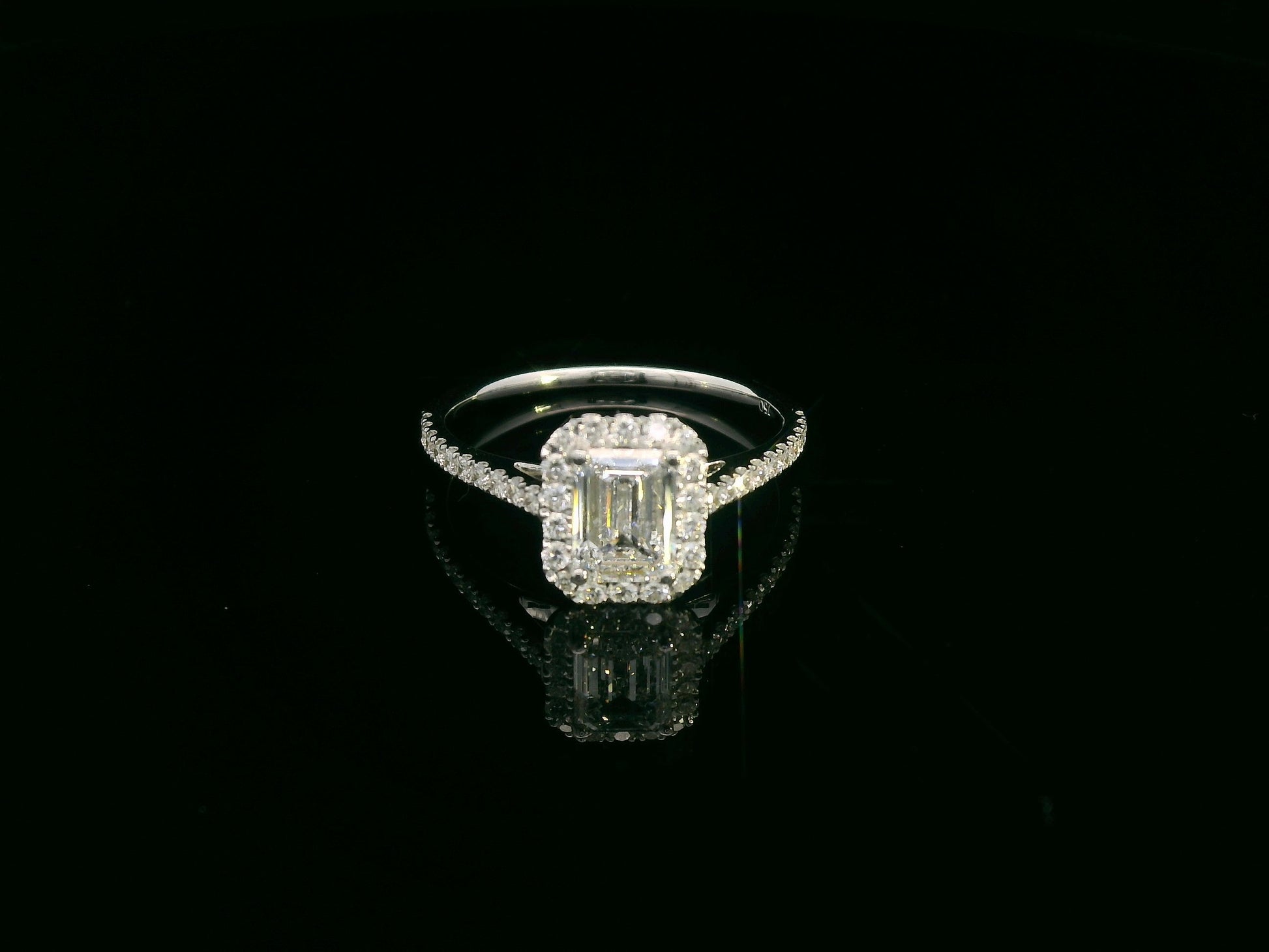 18K white gold emerald cut diamond bridal ring set with GIA certified 1.00 carat center diamond by Emirates Diamonds