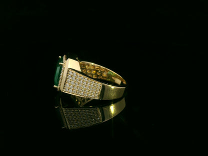 Men’s 18K yellow gold emerald and diamond statement ring featuring a 3.30 carat emerald with diamond halo and wide pavé band by Emirates Diamonds