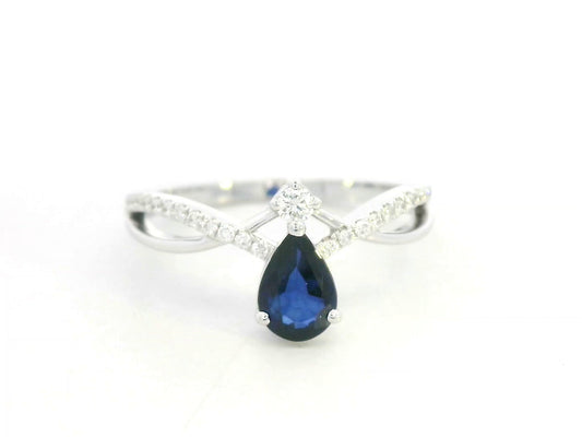 18K white gold blue sapphire and diamond crossover band ring, pear-shaped sapphire with pavé diamond accents by Emirates Diamonds