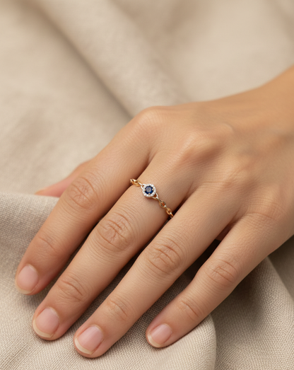 18K yellow gold blue sapphire and diamond halo ring with delicate chain band, 0.21 carat gemstones by Emirates Diamonds