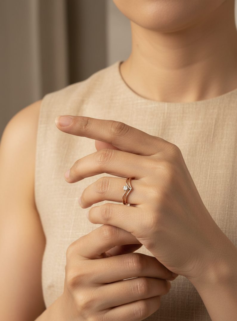 18K yellow gold V-shaped diamond ring with minimalist chevron design by Emirates Diamonds