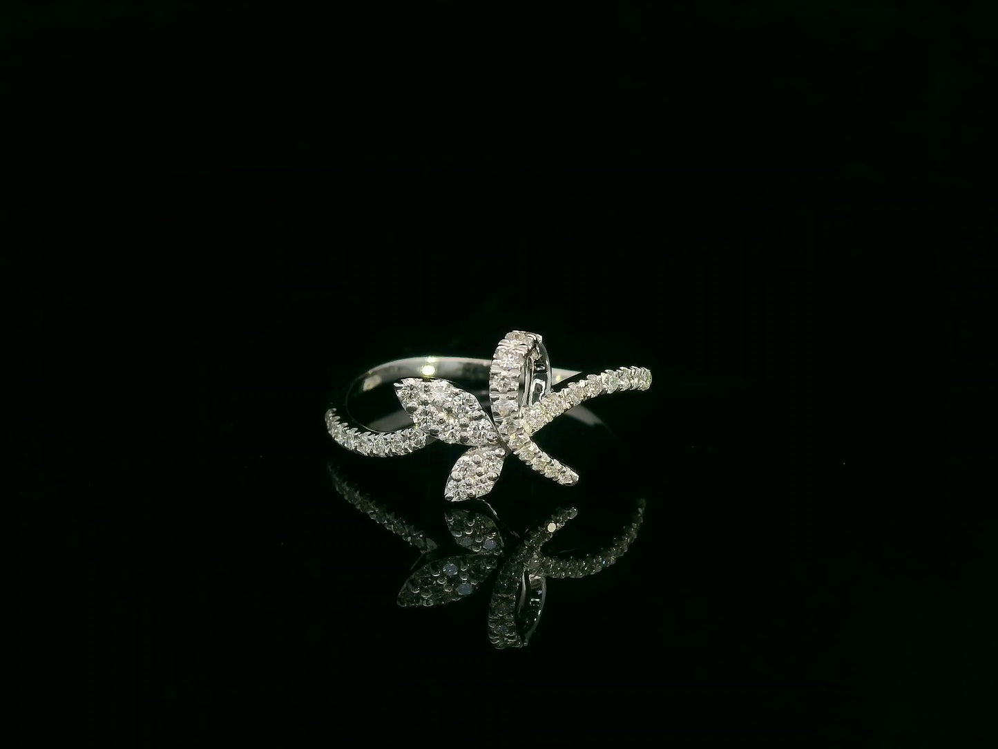 18K white gold diamond leaf crossover ring by Emirates Diamonds