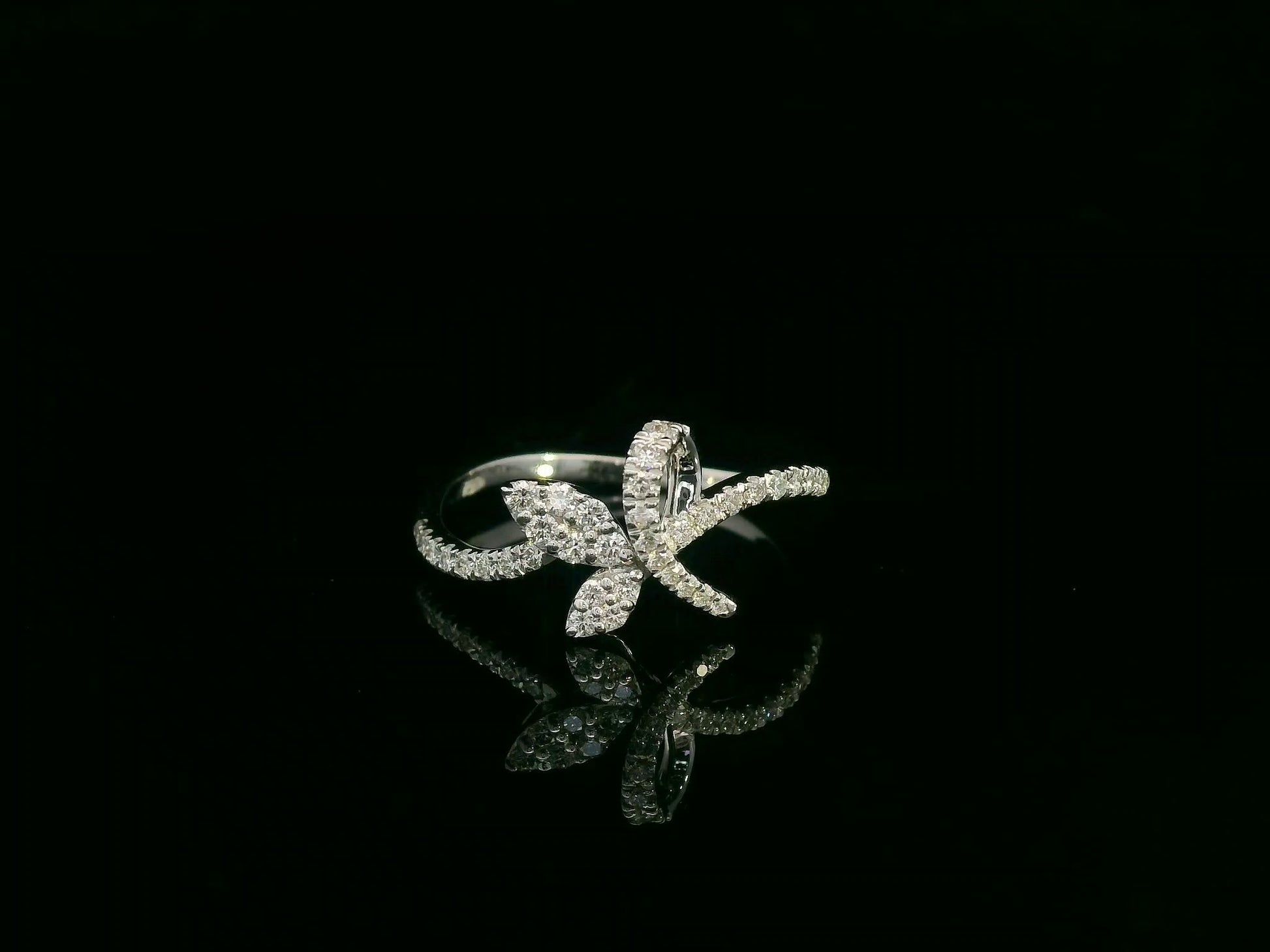 18K white gold diamond leaf crossover ring by Emirates Diamonds